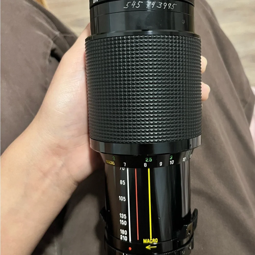 Black Telephoto and Standard Camera Lenses with Accessories